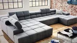 Modern sofa in the living room with a sleeping place photo