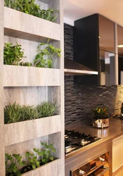 Flowers In The Kitchen In The Interior On The Wall