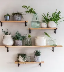 Flowers in the kitchen in the interior on the wall