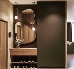 Modern sliding wardrobe in the hallway with a mirror photo design