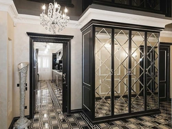 Modern sliding wardrobe in the hallway with a mirror photo design