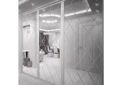 Modern sliding wardrobe in the hallway with a mirror photo design