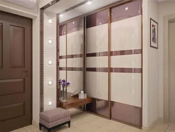Modern sliding wardrobe in the hallway with a mirror photo design