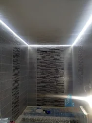 Light lines on a suspended ceiling in the bathroom photo