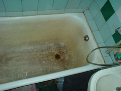 Old bathtub in the apartment photo
