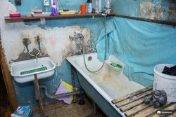 Old bathtub in the apartment photo