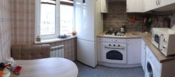 Kitchen design in Khrushchev with a refrigerator and washing machine