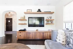 Modern Shelves On The Wall In The Living Room Interior With TV