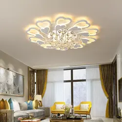 Chandelier in the living room on a suspended ceiling in a modern style photo