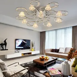 Chandelier in the living room on a suspended ceiling in a modern style photo