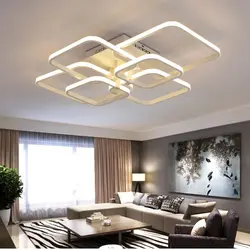 Chandelier in the living room on a suspended ceiling in a modern style photo