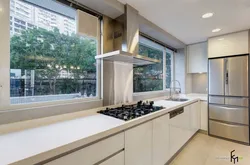 Kitchen in the house design photo with a window in the work area