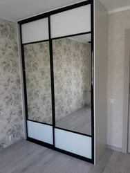 Wardrobe In The Bedroom With A Mirror For Two Doors Photo