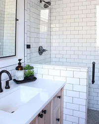 Grout on white tiles in the kitchen photo