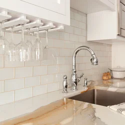 Grout on white tiles in the kitchen photo