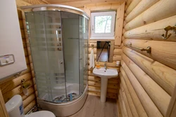 Bathroom with shower in a country house in a wooden house photo