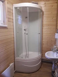 Bathroom with shower in a country house in a wooden house photo
