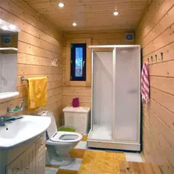 Bathroom with shower in a country house in a wooden house photo