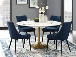 White table with black chairs in the kitchen interior