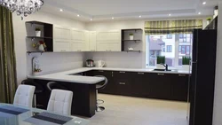 Modern kitchens with a breakfast bar and a window photo