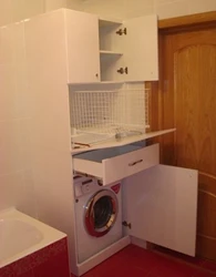 Photo of bathroom cabinets above the washing machine