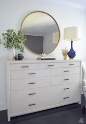 Bedroom design with chest of drawers and mirror