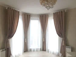 Wall cornices in the living room interior