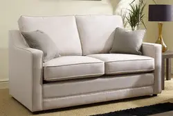 Small sofa with sleeping place in the room photo