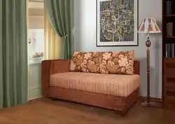 Small sofa with sleeping place in the room photo