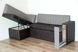 Small sofa with sleeping place in the room photo