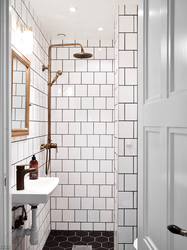 Bath white tiles with colored grout photo