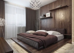 Bedroom interior with gray wallpaper and brown furniture