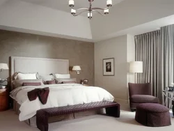 Bedroom interior with gray wallpaper and brown furniture