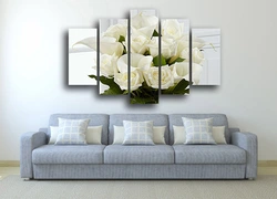 Modular paintings in the living room interior above the sofa