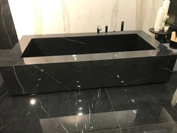 Black countertop in the bathroom photo