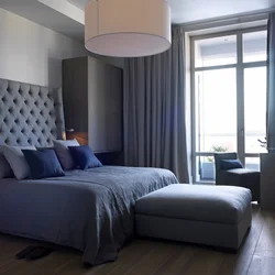 Bedroom design with gray bed and gray curtains
