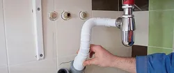 Sewer pipe in the kitchen photo