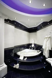 Photo of a bathroom with a jacuzzi and toilet