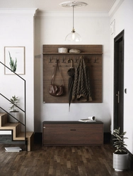 Photo of shoe racks and hanger in the hallway
