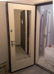 Photo of a door with a mirror from an apartment