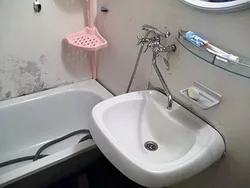 Bathroom with one faucet for bathtub and sink photo