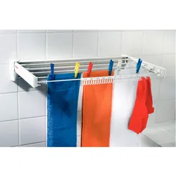 Wall-mounted dryer in the bathroom interior