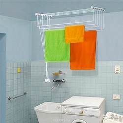 Wall-mounted dryer in the bathroom interior