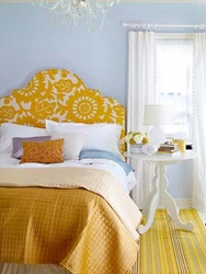 Yellow bed in the bedroom interior photo