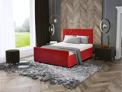 Red bed in the bedroom interior photo