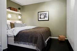 Bedroom design with a bed along the wall photo