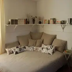 Bedroom design with a bed along the wall photo