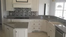 White granite countertop in the kitchen interior