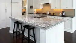 White granite countertop in the kitchen interior