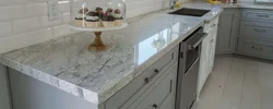 White granite countertop in the kitchen interior